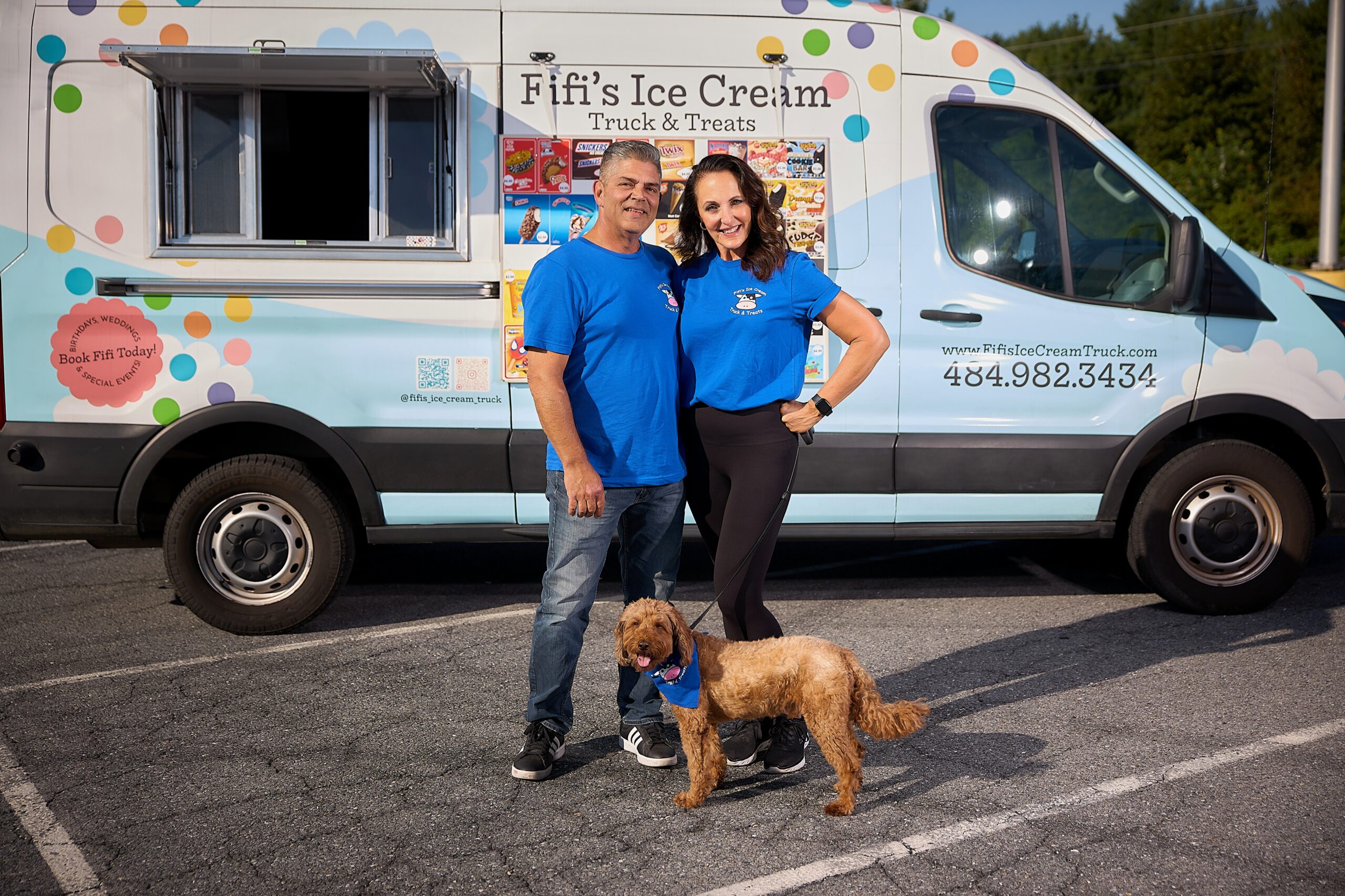 Thea Tantaros (right) poses for a picture with her husband, Keith (left), and their dog in front of their Fifi's Ice Cream truck.