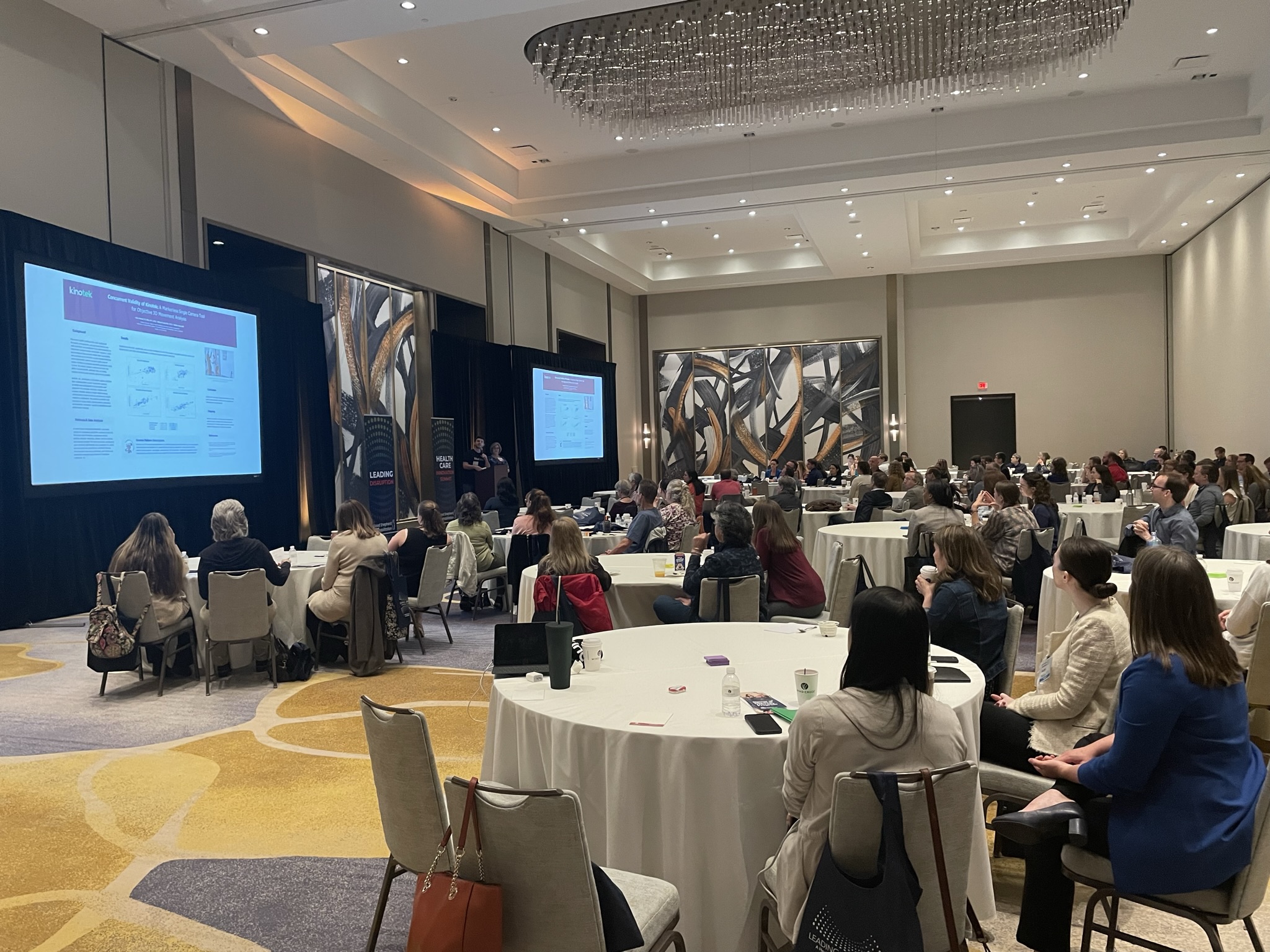 Attendees of Good Shepherd Rehabilitation's 2023 Leading Disruption: A Health-Care Innovation Summit conference listen to a speaker presentation