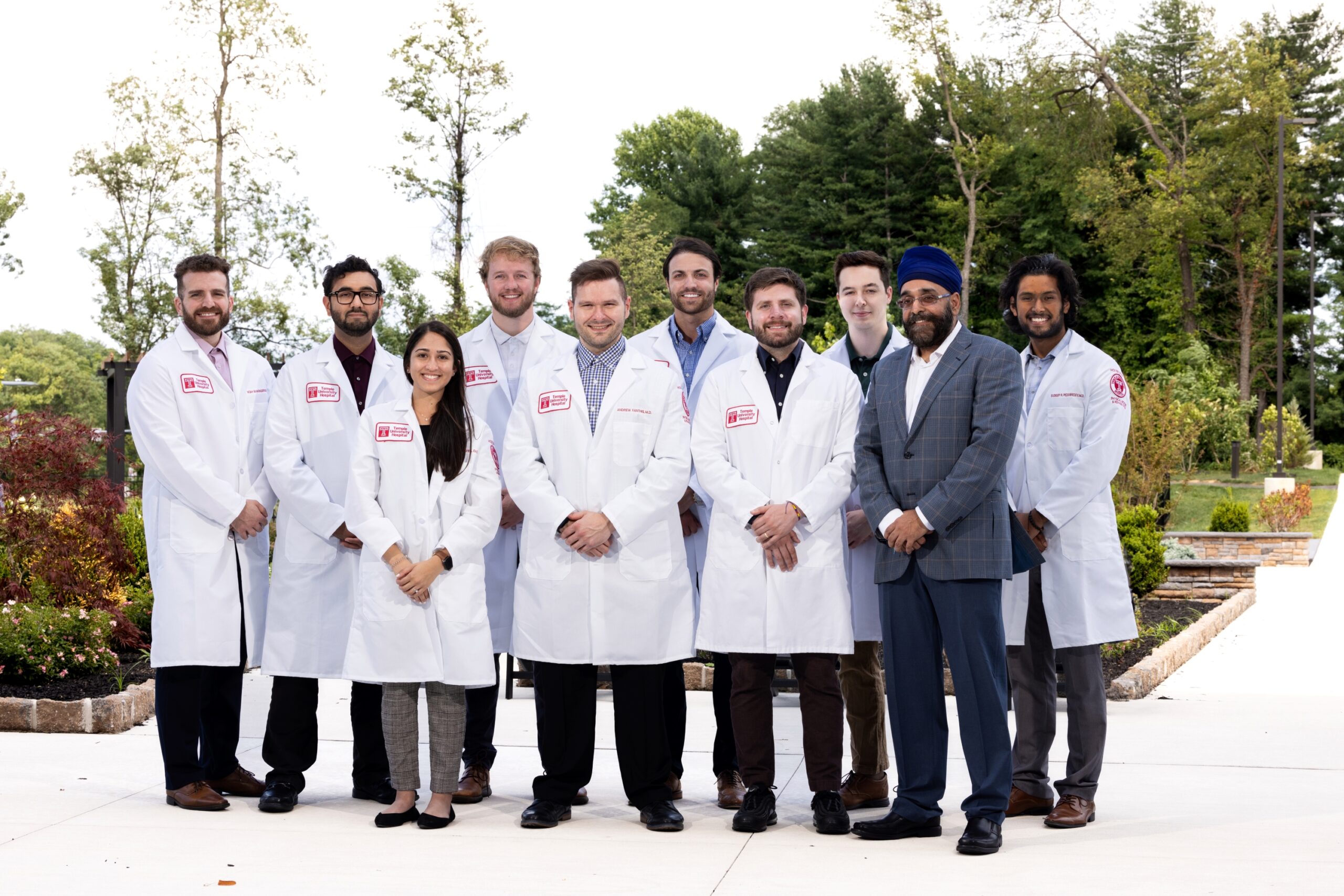 Temple University School of Medicine Physical Medicine and Rehabilitation (PM&R) residents standing for a photo with Dr. Sandeep Singh, Good Shepherd Rehabilitation senior vice president of medical affairs and chief medical officer